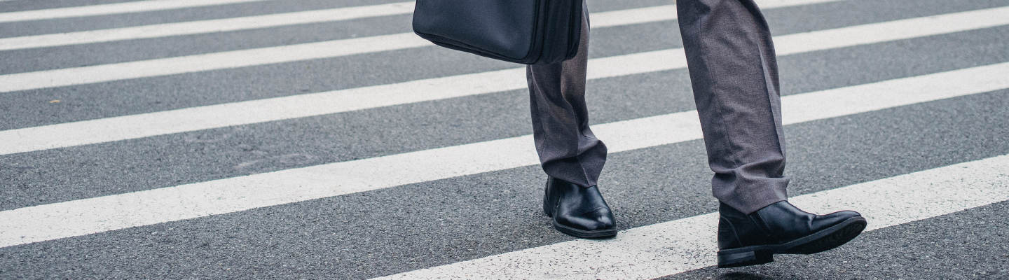 man walking on a crosswalk 